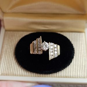 10k gold diamond ring size 7. Sizeable. Great design to this ring. Solid ring. N